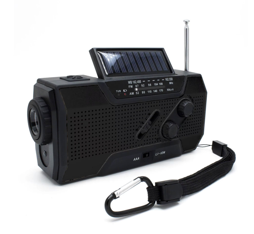 A black portable emergency weather radio with a solar panel, hand crank, LED flashlight, and various control buttons on the front.