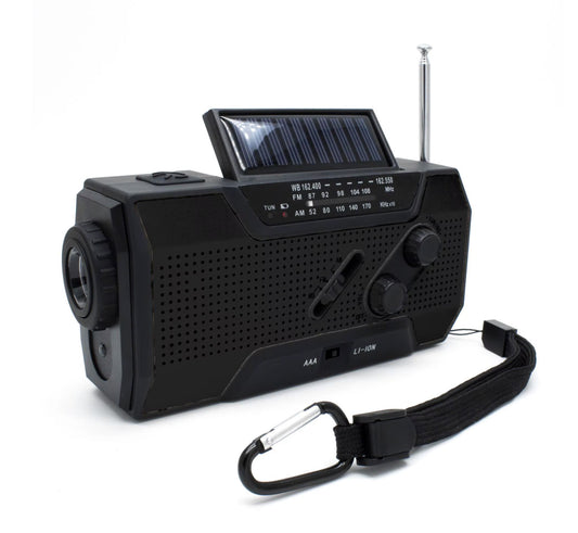 A black portable emergency weather radio with a solar panel, hand crank, LED flashlight, and various control buttons on the front.